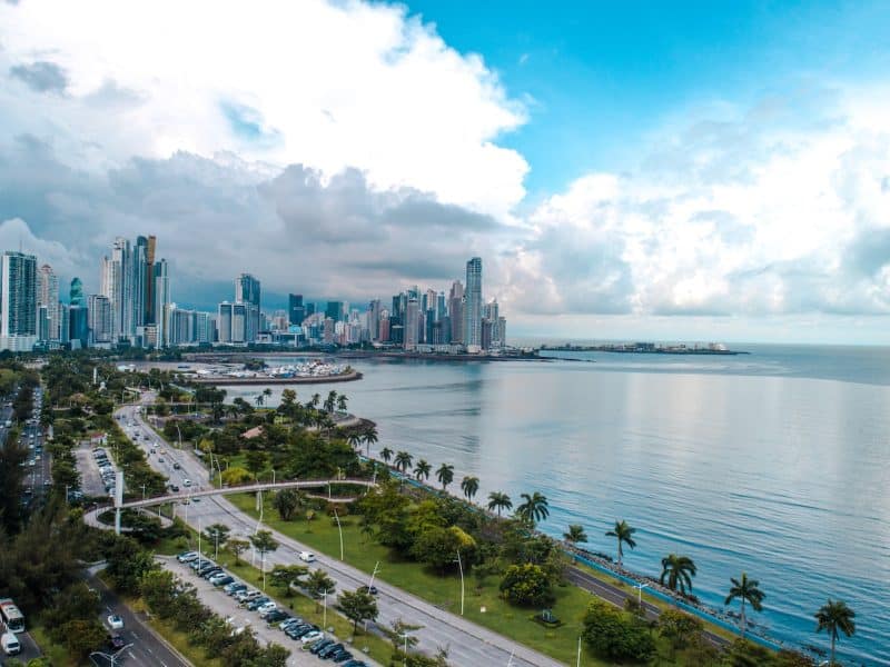 a large body of water with a city in the background